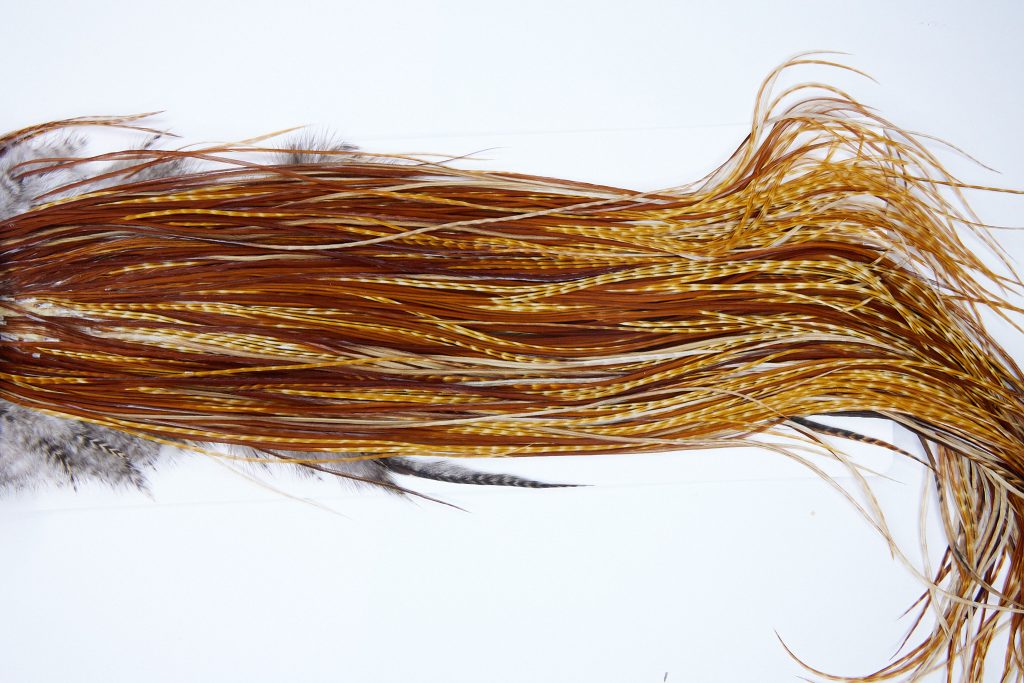 1821 Heritage Dry Fly Hackle, 1 Grade Rooster Saddle Barred Ginger Ties Size 14-16